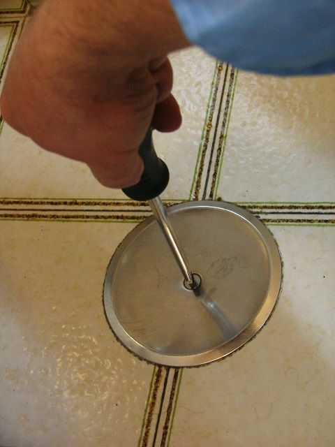 unscrew the screw and remove the metal plate