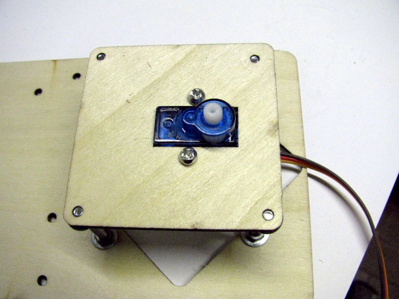 Attaching the Robot Arm Rotation Servo Support Base to the Fixed Base Attaching the Robot Arm Rotation Servo Support Base to the Fixed Base