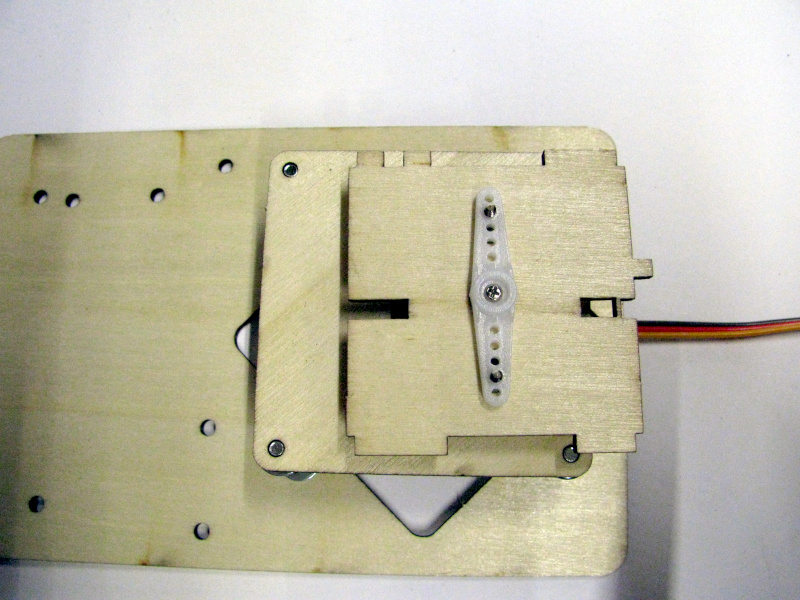 Assembling the rotation base of the robotic arm on the rotation servo Assembling the rotation base of the robotic arm on the rotation servo