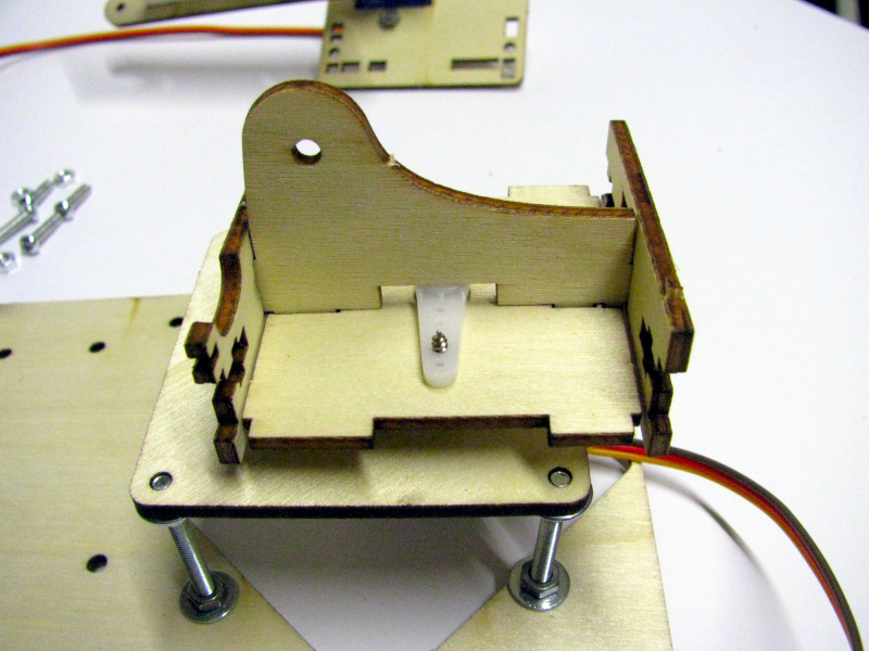 Mounting the first arm segment support on the rotating base Mounting the first arm segment support on the rotating base