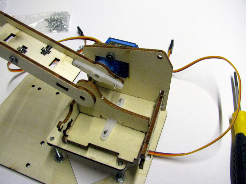 Mounting the first segment of the robotic arm on its support Mounting the first segment of the robotic arm on its support