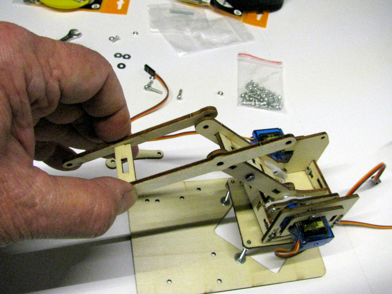 Attaching the second segment of the robotic arm Attaching the second segment of the robotic arm