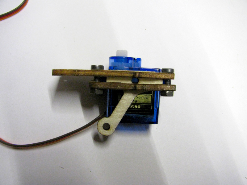 Mounting the second servo mount and securing with screws and nuts Mounting the second servo mount and securing with screws and nuts