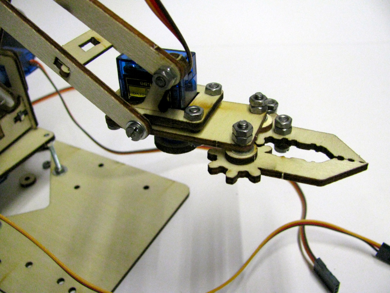 attach the gripper to the second segment of the robotic arm attach the gripper to the second segment of the robotic arm