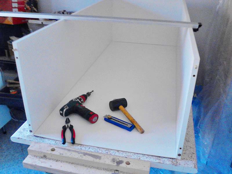 Mounting the back of the cabinet in its appropriate place