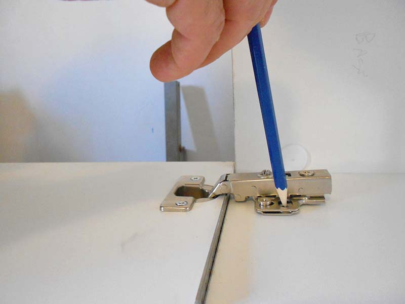 We mark the position of the fixing holes on the side of the furniture